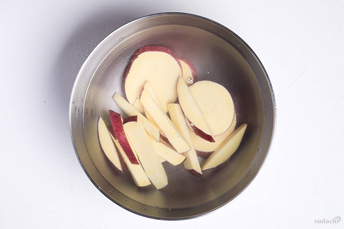 soaking cut Japanese sweet potato in a bowl of cold water