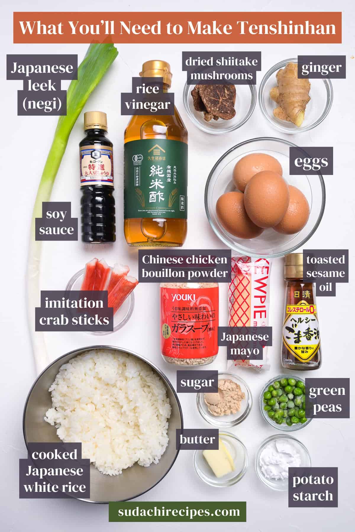 Ingredients needed to make tenshinhan on a white background with labels. From top to bottom, left to right: Japanese leek, rice vinegar, dried shiitake mushrooms, ginger, soy sauce, eggs, imitation crab sticks, Chinese chicken bouillon powder, toasted sesame oil, Japanese mayp, sugar, green peas, cooked Japanese white rice, butter, potato starch.