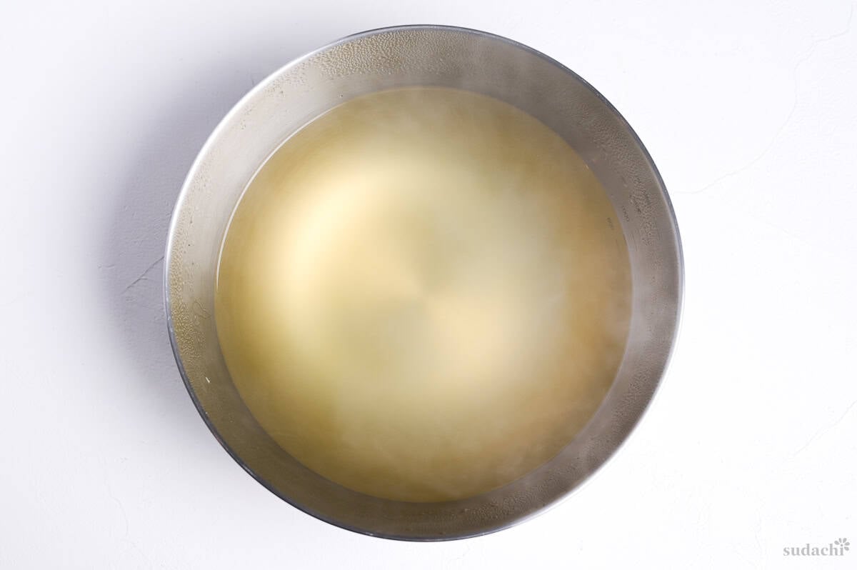 strained homemade dashi in a steel mixing bowl