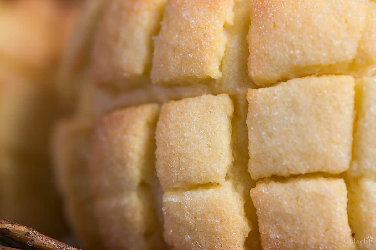 close up of melon pan's cookie crust with granulated sugar coating