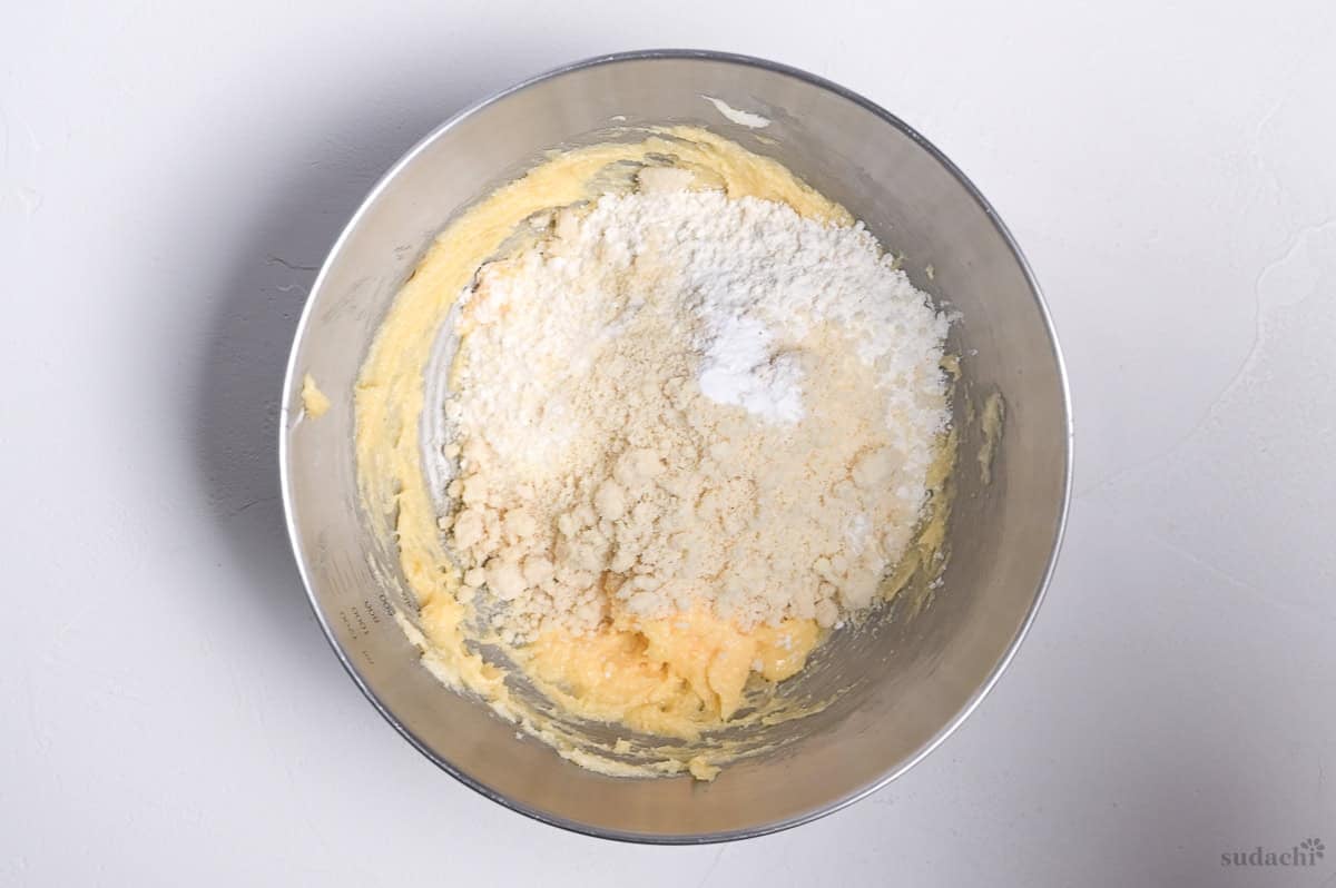almond flour, all purpose flour and baking powder added to creamed butter, sugar and egg mixture to make cookie top for melon pan
