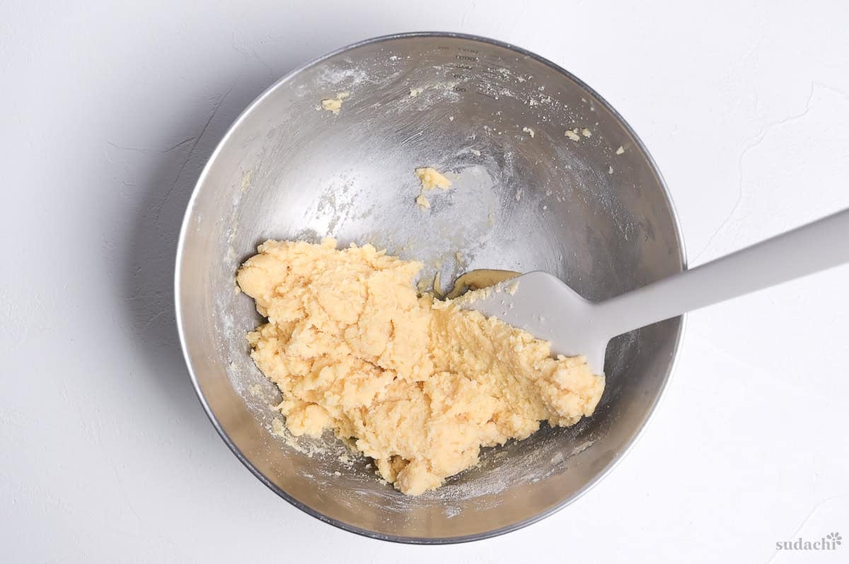 melon pan cookie dough in a steel mixing bowl with spatula