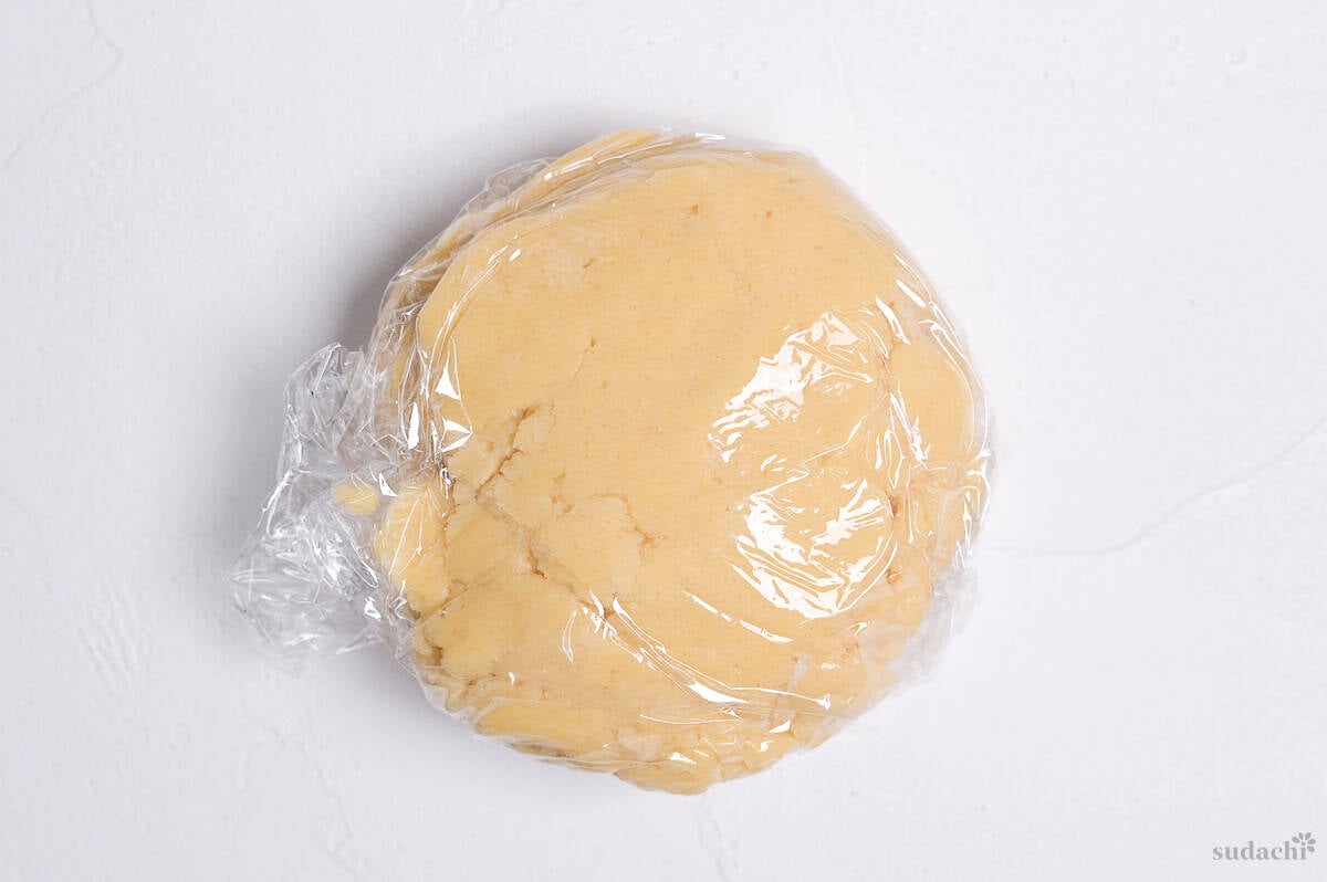 melon pan cookie dough wrapped with plastic wrap ready for chilling