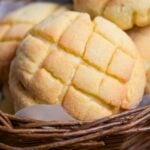 close up of homemade Japanese melon pan in a wicker basket