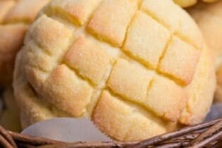 close up of homemade Japanese melon pan in a wicker basket