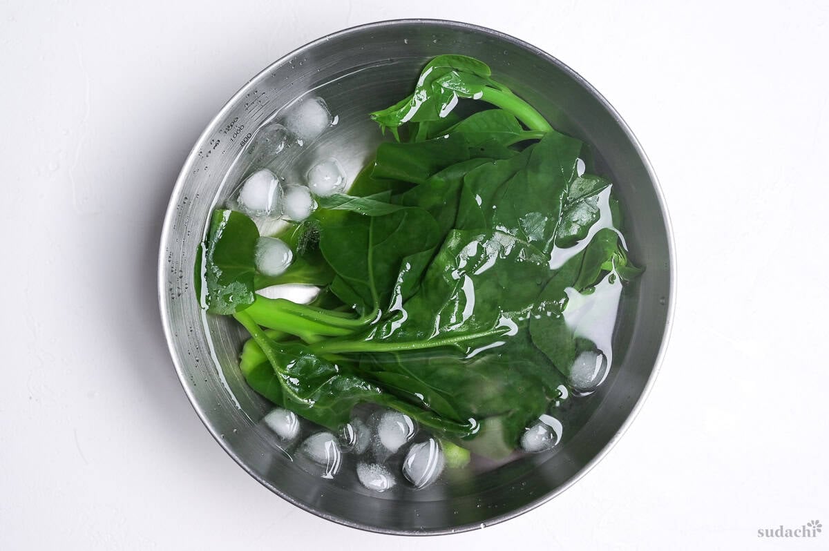 resting blanched greens in an ice water bath